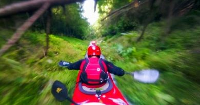 Riding a Kayak Down a Mountain in a Ditch